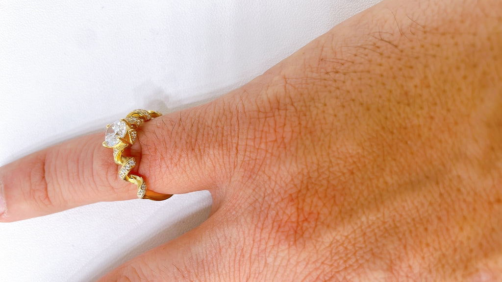18K Gold Solitaire Ring with Side Stones