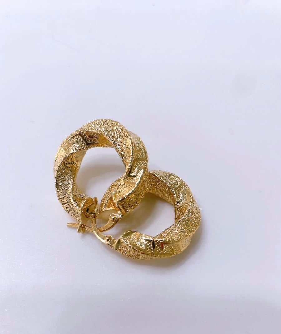 Unisex Hoop Earrings
Satin finish with engraved Greek pattern
Made entirely of 18kt solid gold

Diameter: 2 cm
Weight: 3.4 g